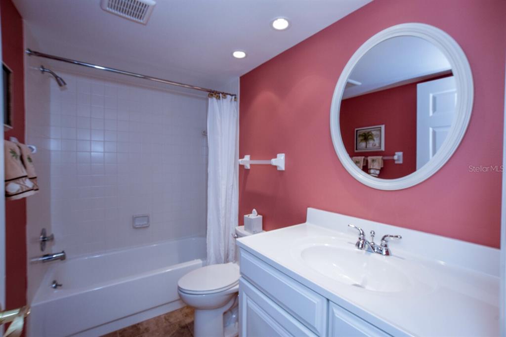 433 Cerromar Lane, Unit 438 Venice, FL 34293 - Photo 22 of 44 a bathroom with a sink and a mirror