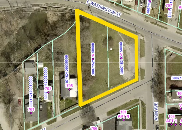 a view of a street with stores