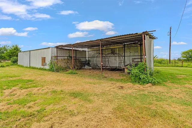 a view of a backyard of the house