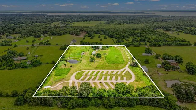 a view of a swimming pool with a yard and outdoor seating