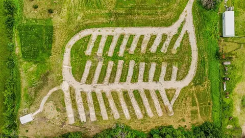 a view of a swimming pool with a yard