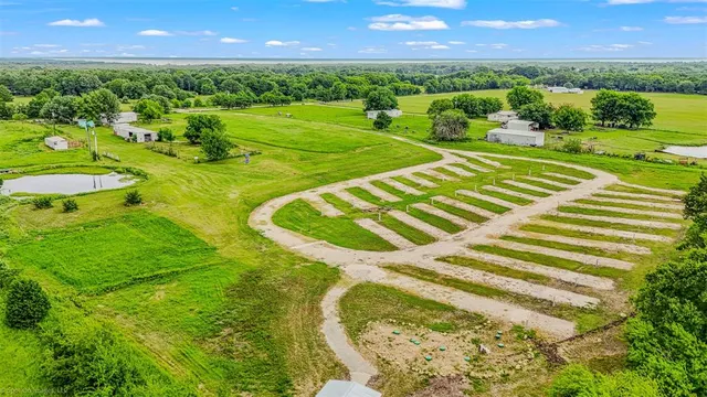 a aerial view of a house with a yard