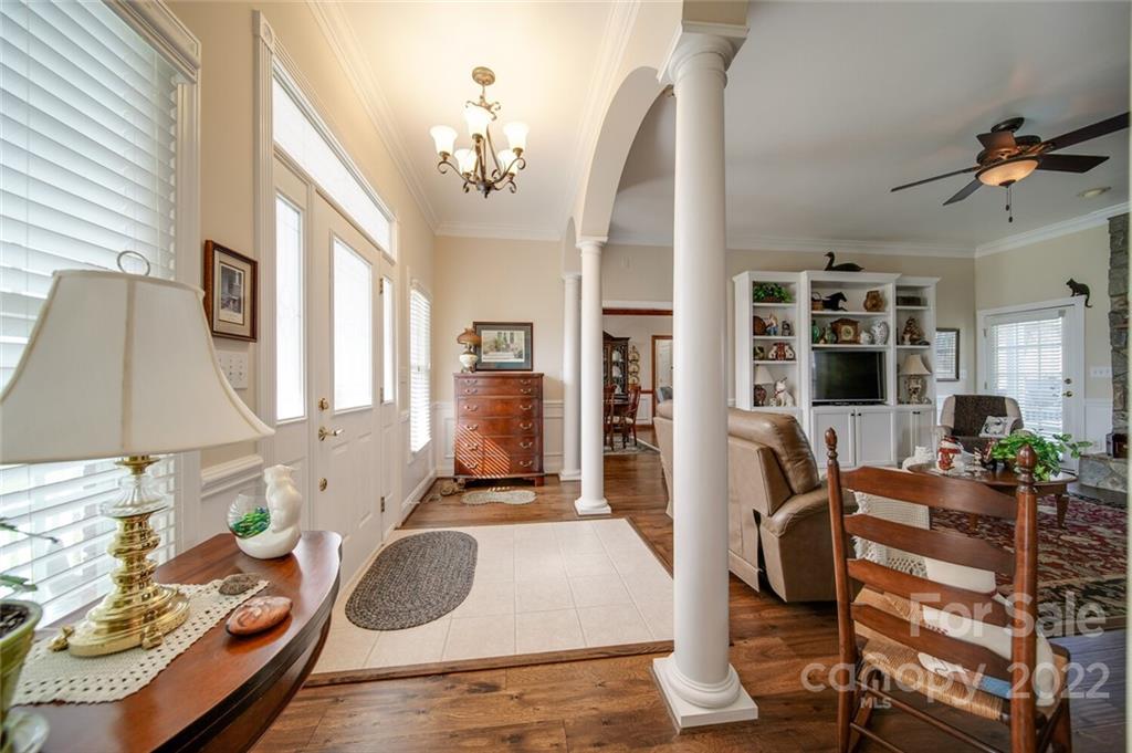 155 St Peters Church Road Gold Hill, NC 28071 - Photo 13 of 47 a living room with furniture a flat screen tv and a table
