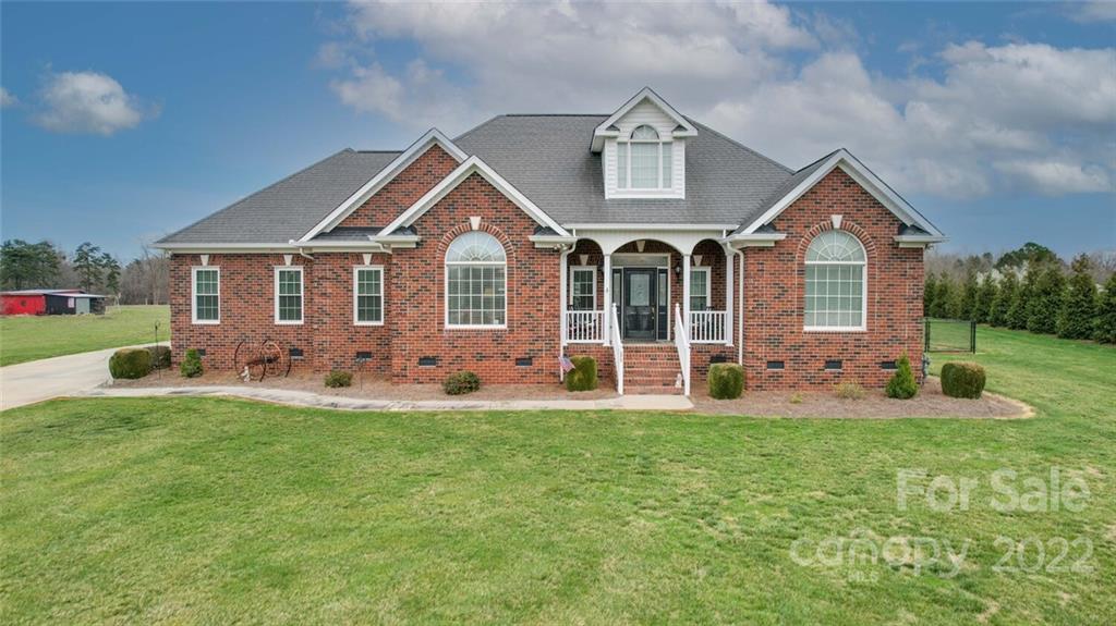 155 St Peters Church Road Gold Hill, NC 28071 - Photo 2 of 47 a front view of a house with a yard and porch