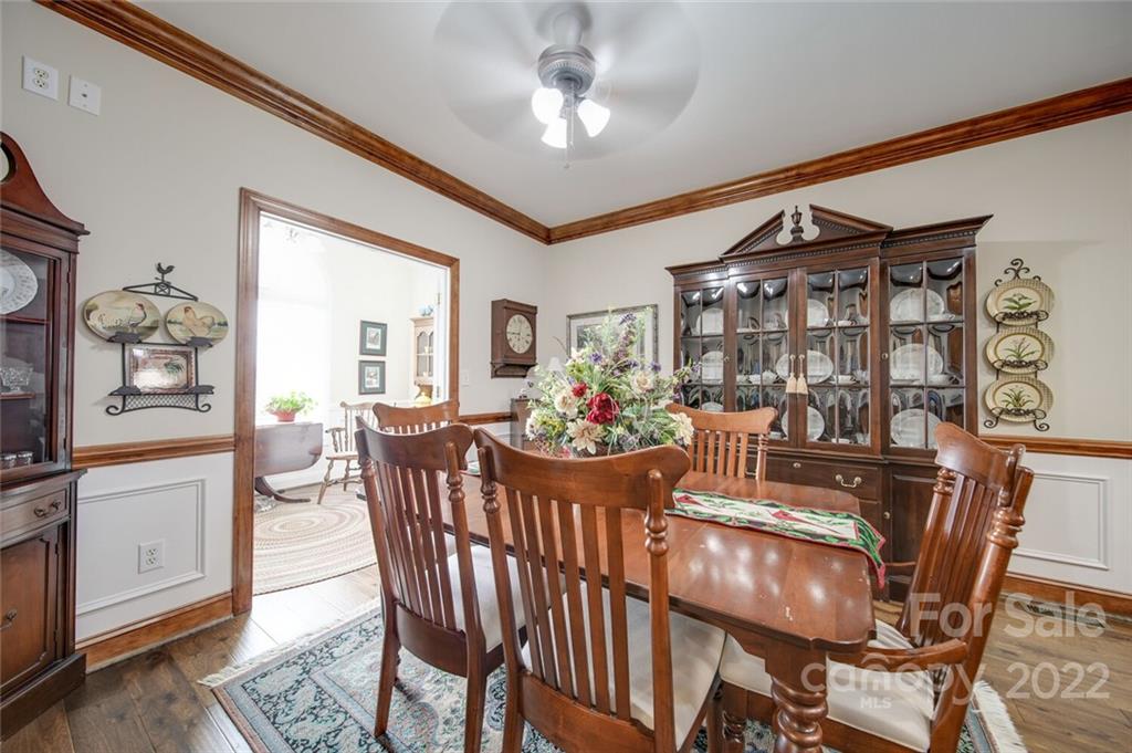 155 St Peters Church Road Gold Hill, NC 28071 - Photo 23 of 47 a view of a dining room with furniture window and wooden floor