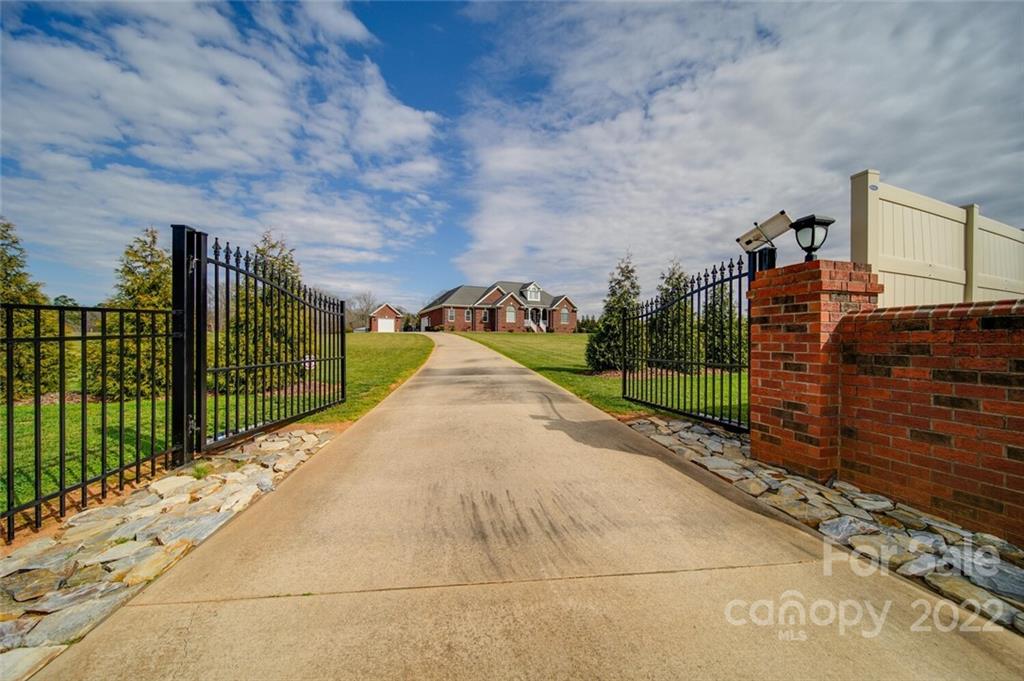 155 St Peters Church Road Gold Hill, NC 28071 - Photo 3 of 47 a view of a pathway with a wrought fence