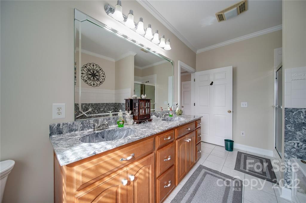 155 St Peters Church Road Gold Hill, NC 28071 - Photo 33 of 47 a bathroom with a sink double vanity and a mirror