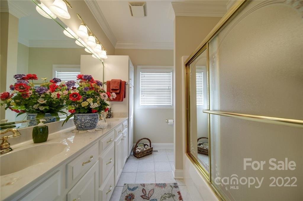 155 St Peters Church Road Gold Hill, NC 28071 - Photo 41 of 47 a bathroom with a tub shower and a mirror
