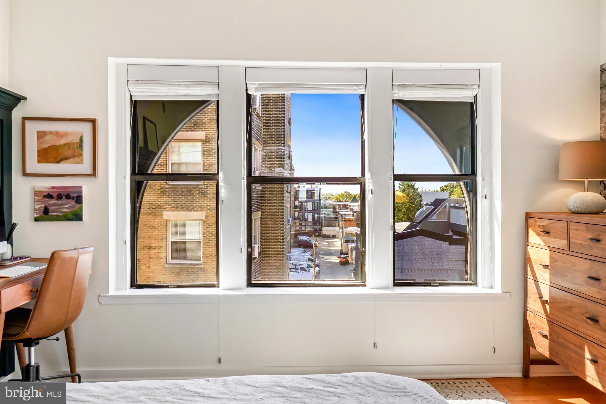 1669 Columbia Road Northwest, Unit 411 Washington, DC 20009 - Photo 39 of 53 Large windows with custom window treatments