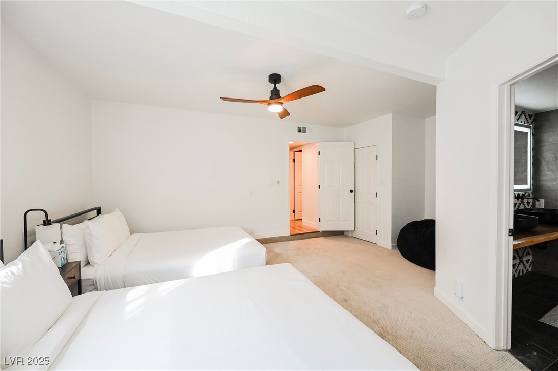 1640 Crystal Shadows Circle Las Vegas, NV 89119 - Photo 16 of 44 Carpeted bedroom with a ceiling fan and baseboards
