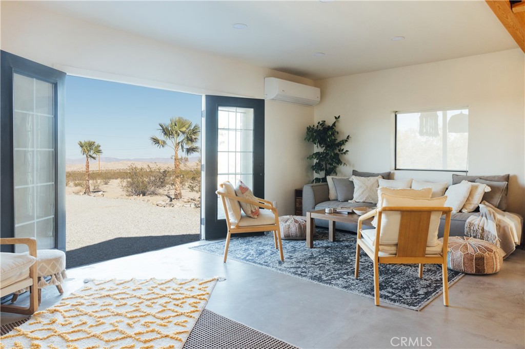 75243 Sullivan Road Twentynine Palms, CA 92277 - Photo 15 of 62 a living room with furniture rug and window