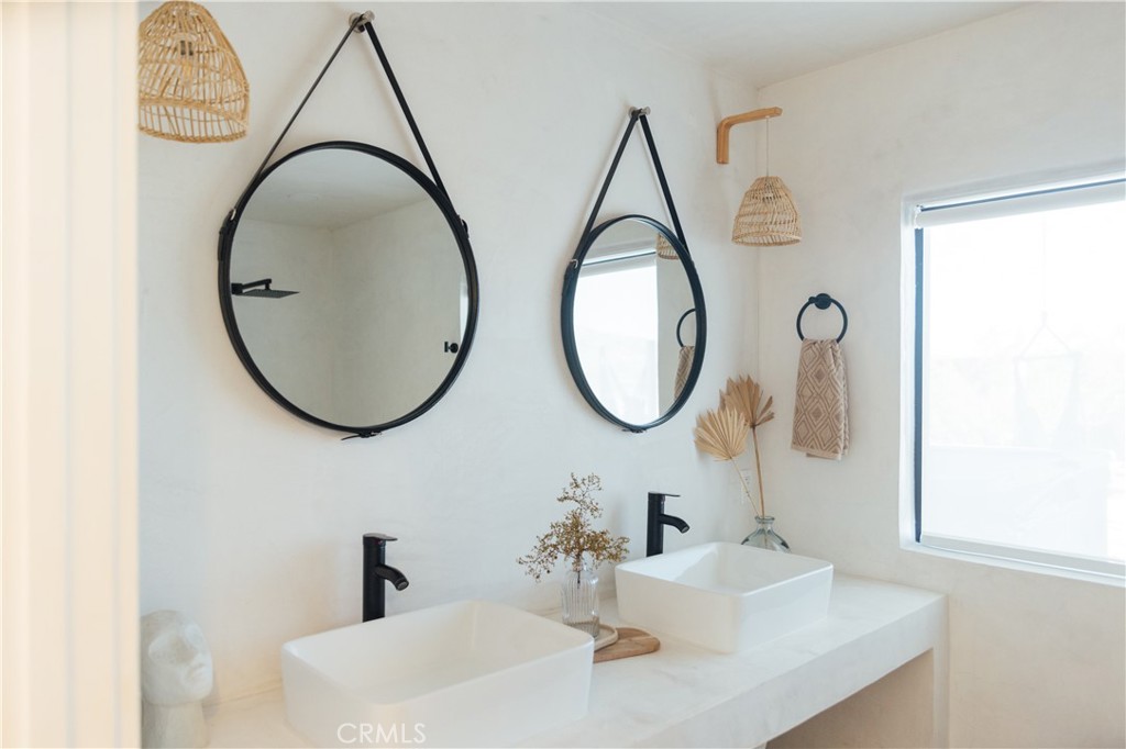 75243 Sullivan Road Twentynine Palms, CA 92277 - Photo 23 of 62 a bathroom with a sink and a mirror