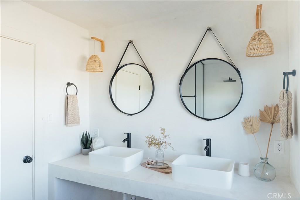 75243 Sullivan Road Twentynine Palms, CA 92277 - Photo 26 of 62 a bathroom with a sink and a mirror