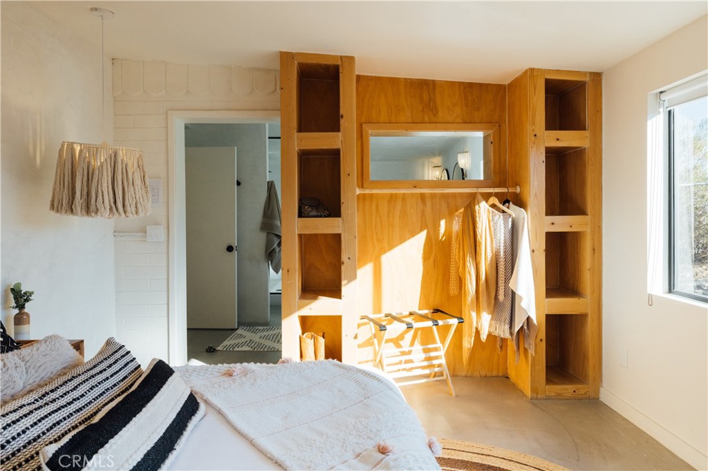 75243 Sullivan Road Twentynine Palms, CA 92277 - Photo 27 of 62 a bedroom with a bed and teddy bear on bed