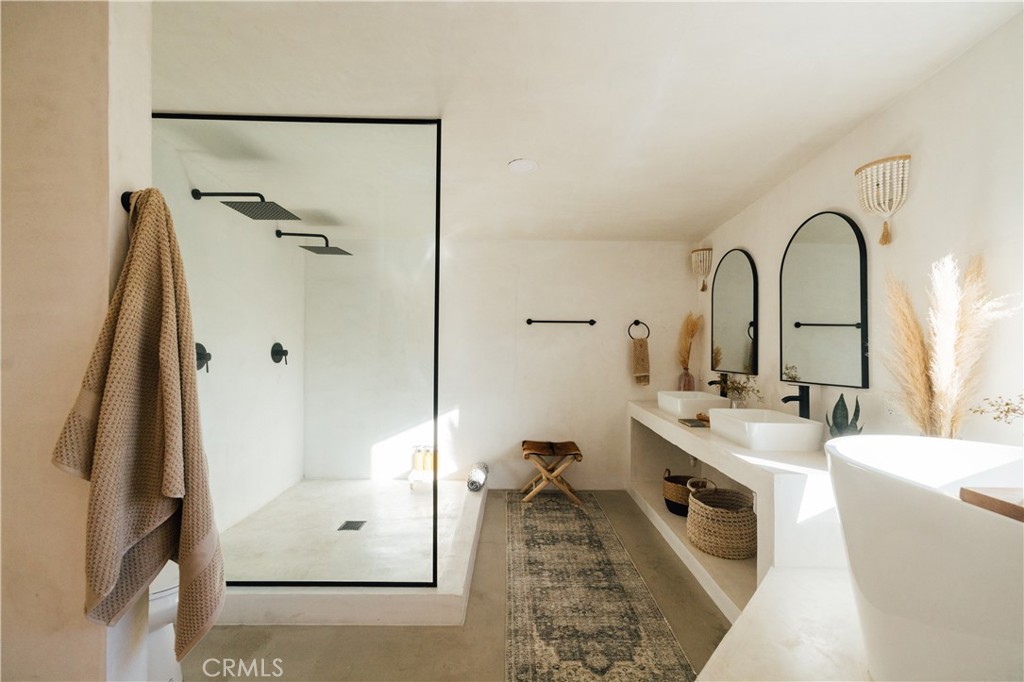 75243 Sullivan Road Twentynine Palms, CA 92277 - Photo 29 of 62 a bathroom with a tub sink and mirror