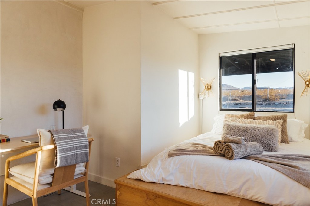 75243 Sullivan Road Twentynine Palms, CA 92277 - Photo 40 of 62 a bedroom with a bed and a window