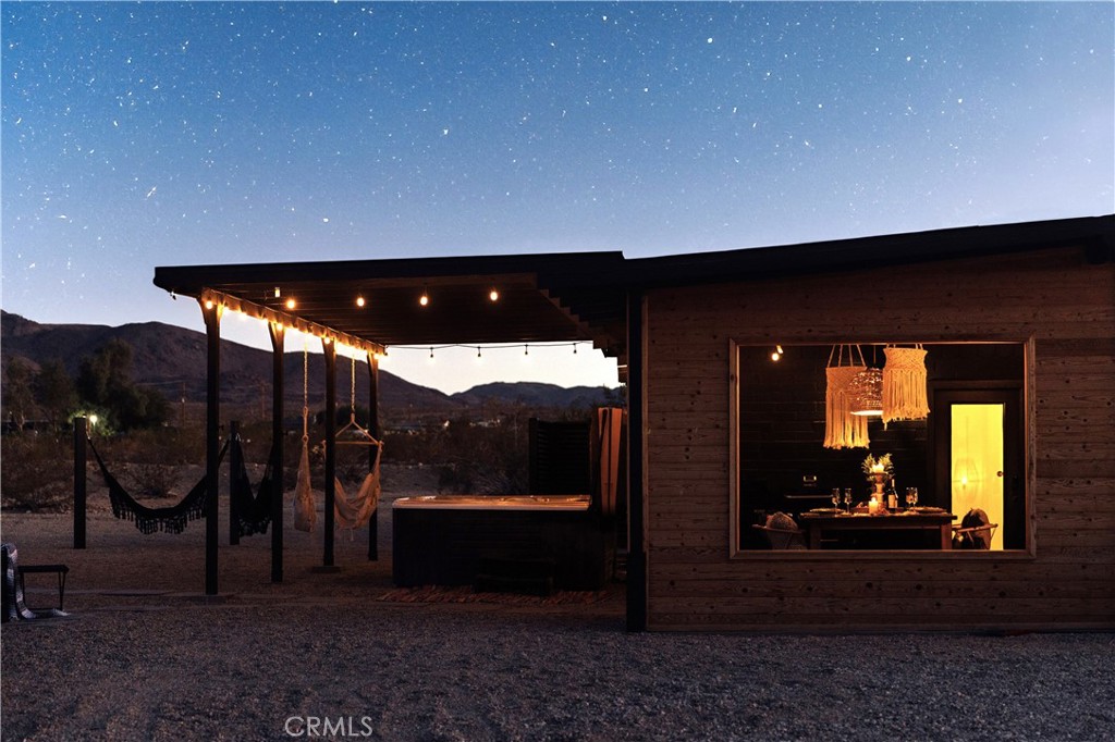 75243 Sullivan Road Twentynine Palms, CA 92277 - Photo 60 of 62 a view of a porch with furniture and yard