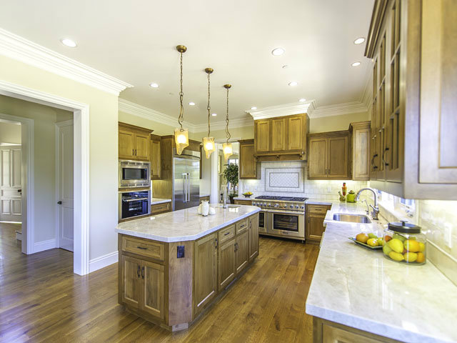 40 Bates Road Hillsborough, CA 94010 - Photo 8 of 17 a large kitchen with stainless steel appliances granite countertop a stove and cabinets