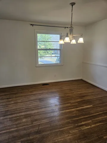 a kitchen with a refrigerator and a stove