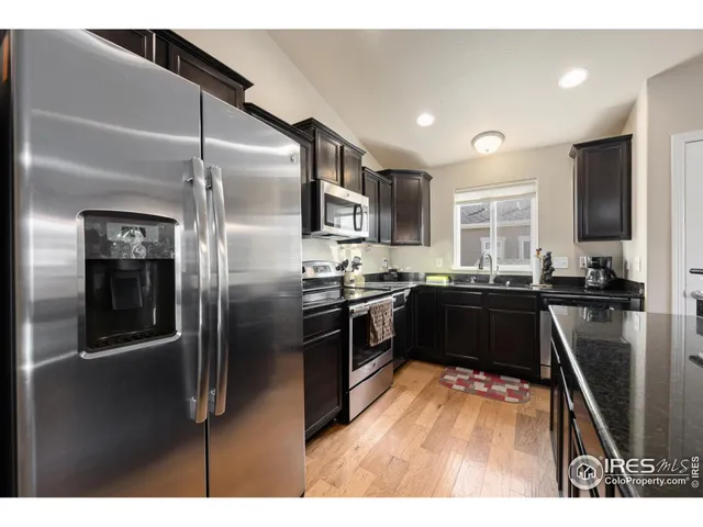 a view of a dining room with furniture and window