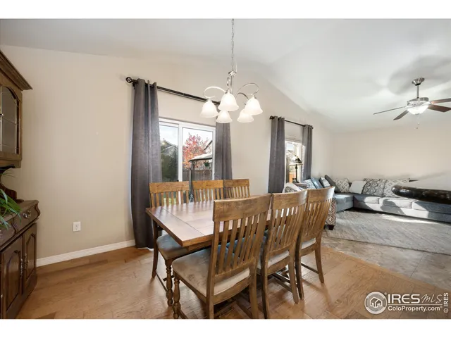 a room with furniture pool table and windows