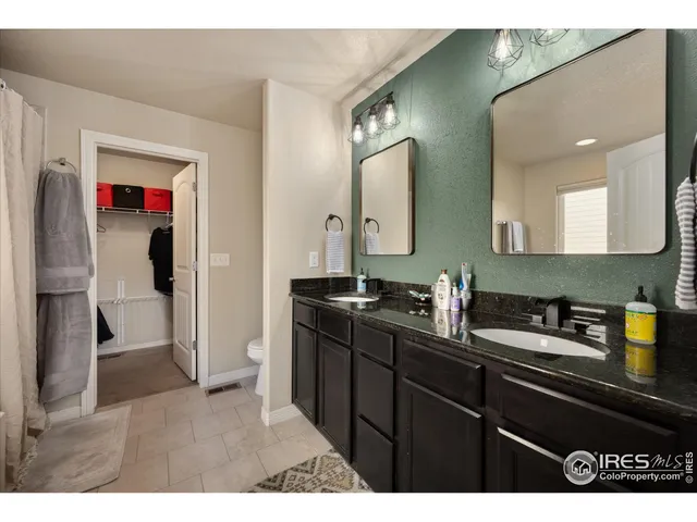 a front view of a house with a garden and swimming pool