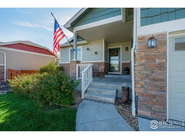 a living room with furniture and a ceiling fan