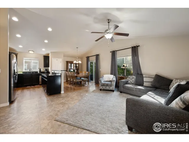 a kitchen with a sink and wooden floor