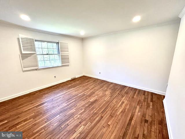 402 Norwood Road Downingtown, PA 19335 - Photo 15 of 21 an empty room with wooden floor and windows