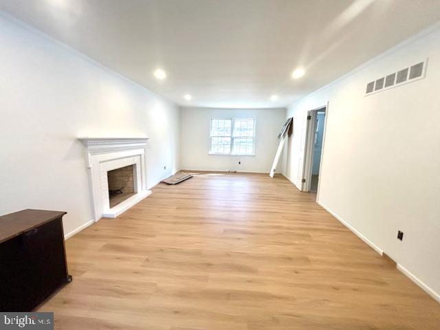 402 Norwood Road Downingtown, PA 19335 - Photo 3 of 22 a view of empty room with wooden floor and fireplace