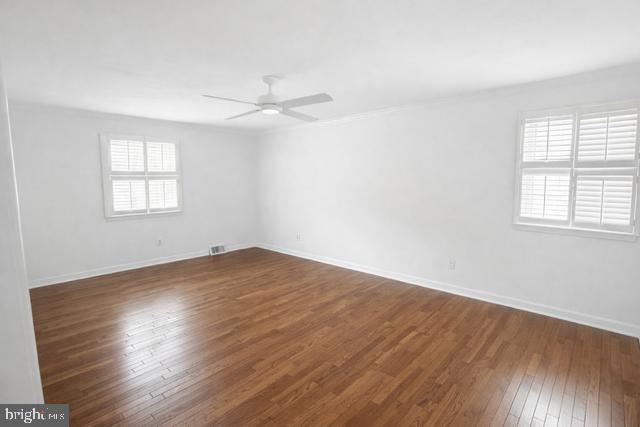 402 Norwood Road Downingtown, PA 19335 - Photo 6 of 22 wooden floor in an empty room with a window