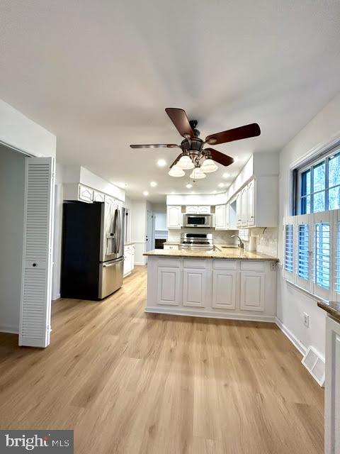 402 Norwood Road Downingtown, PA 19335 - Photo 7 of 21 a large kitchen with stainless steel appliances wooden floors and wooden cabinets