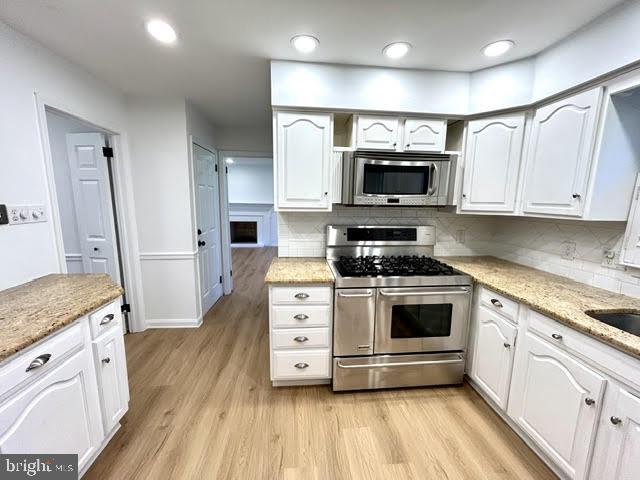 402 Norwood Road Downingtown, PA 19335 - Photo 9 of 21 a kitchen with granite countertop a sink a stove and cabinets