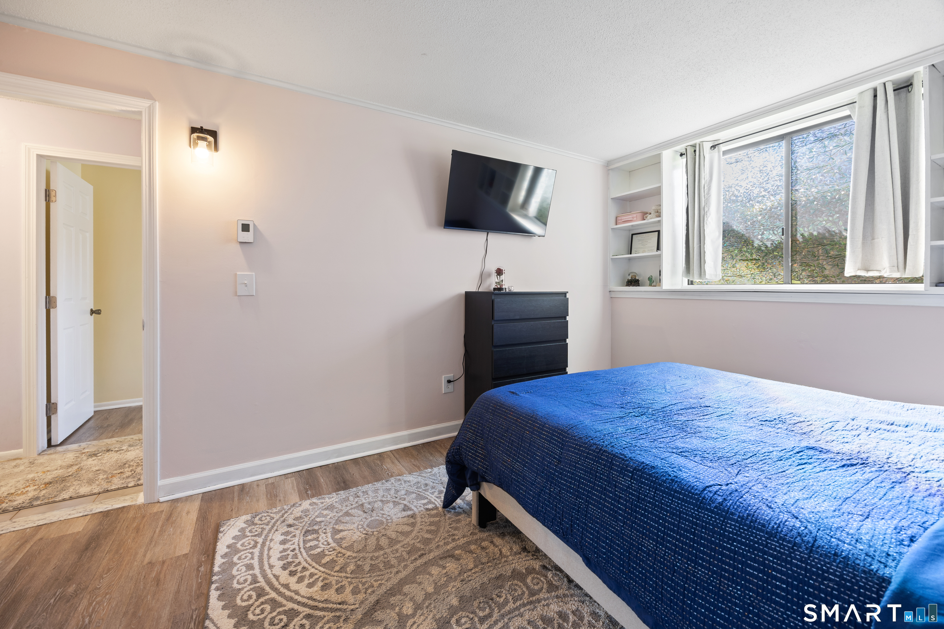 560 Yale Avenue, Unit 82 Meriden, CT 06450 - Photo 16 of 22 a bedroom with a bed and a flat screen tv