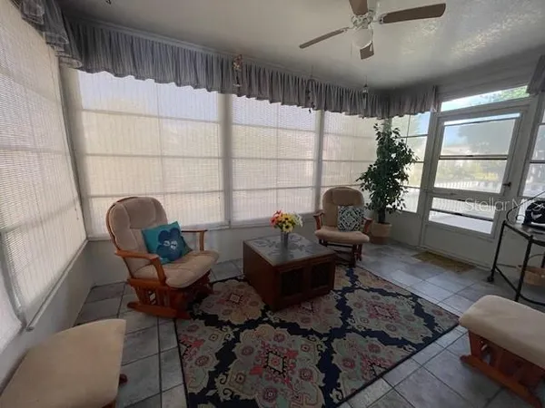 a living room with furniture and a window