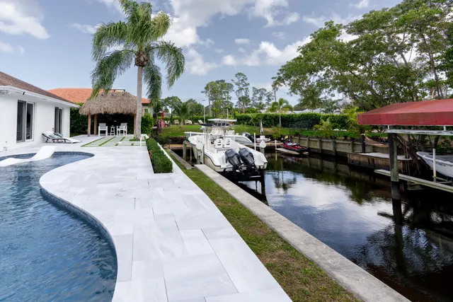 a view of a swimming pool with a patio