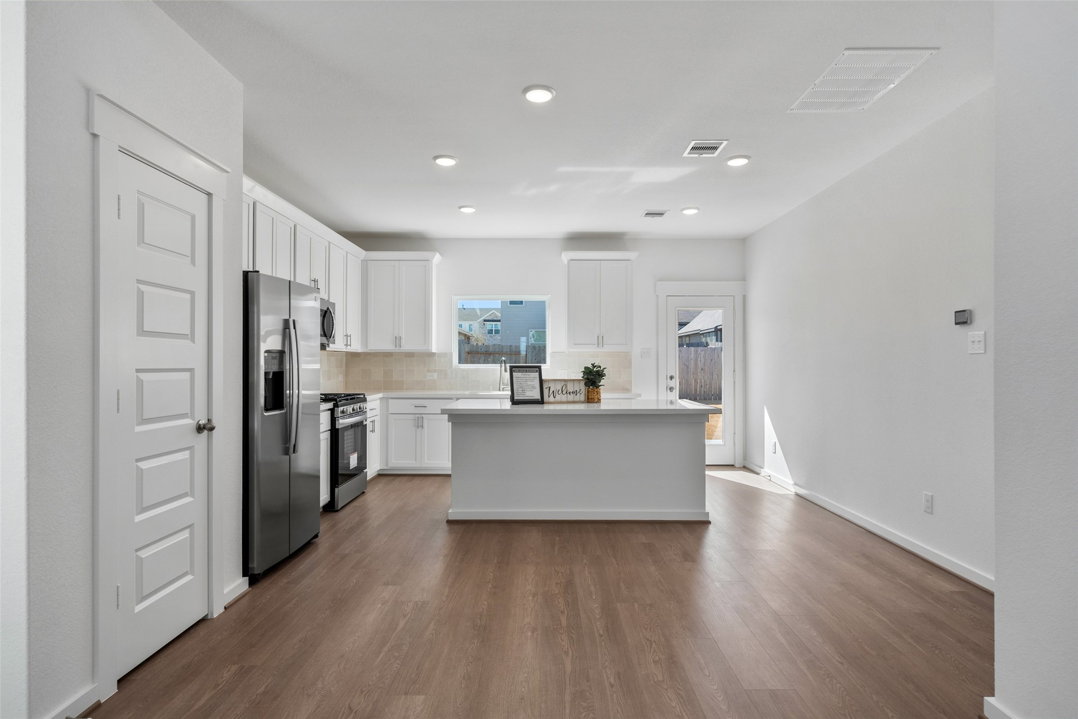 4418 Azalea Blossom Road Pinehurst, TX 77362 - Photo 11 of 31 kitchen comes with refrigerator, garbage disposal, and 2 pantries