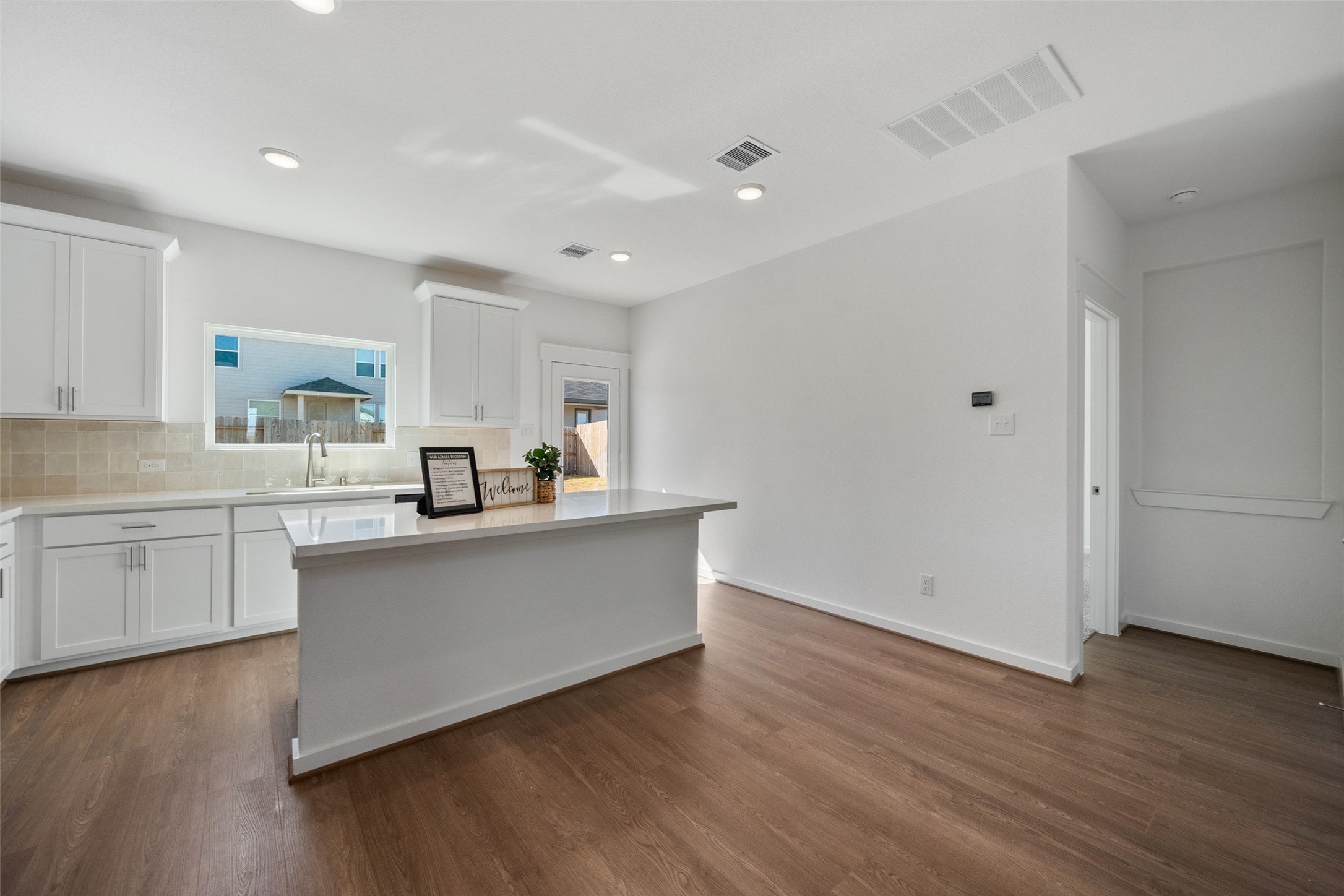 4418 Azalea Blossom Road Pinehurst, TX 77362 - Photo 12 of 31 modern kitchen with storage in the island