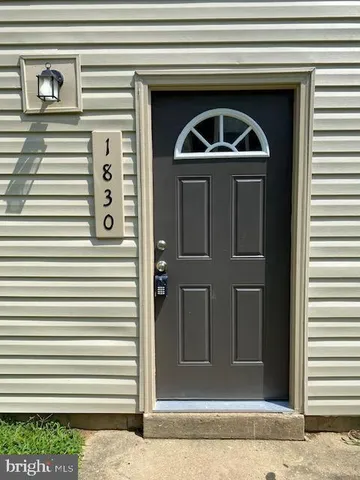 a front view of a house with stairs