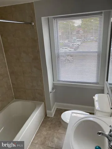 a bathroom with a sink and a bathtub