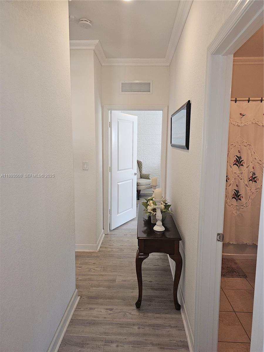 18964 Southwest 135th Avenue Miami, FL 33177 - Photo 13 of 39 a room with furniture and wooden floor