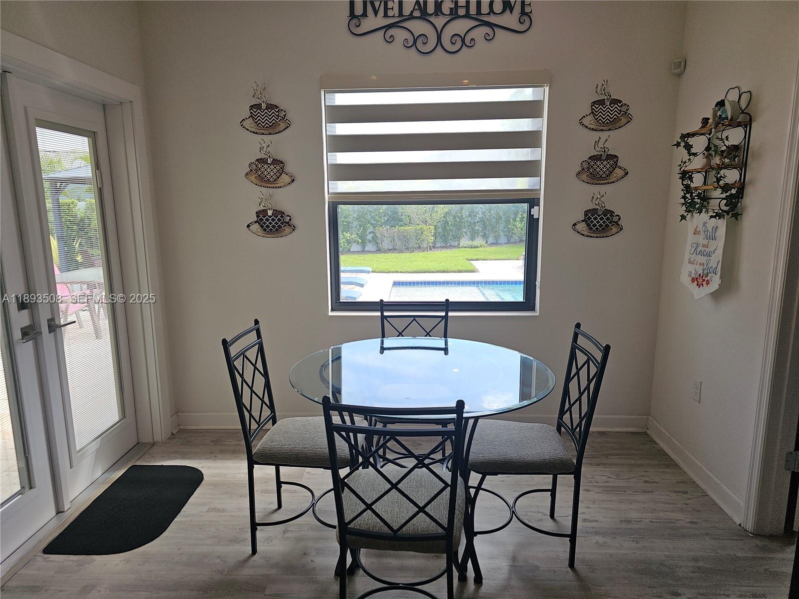 18964 Southwest 135th Avenue Miami, FL 33177 - Photo 18 of 39 a dining room with furniture and window