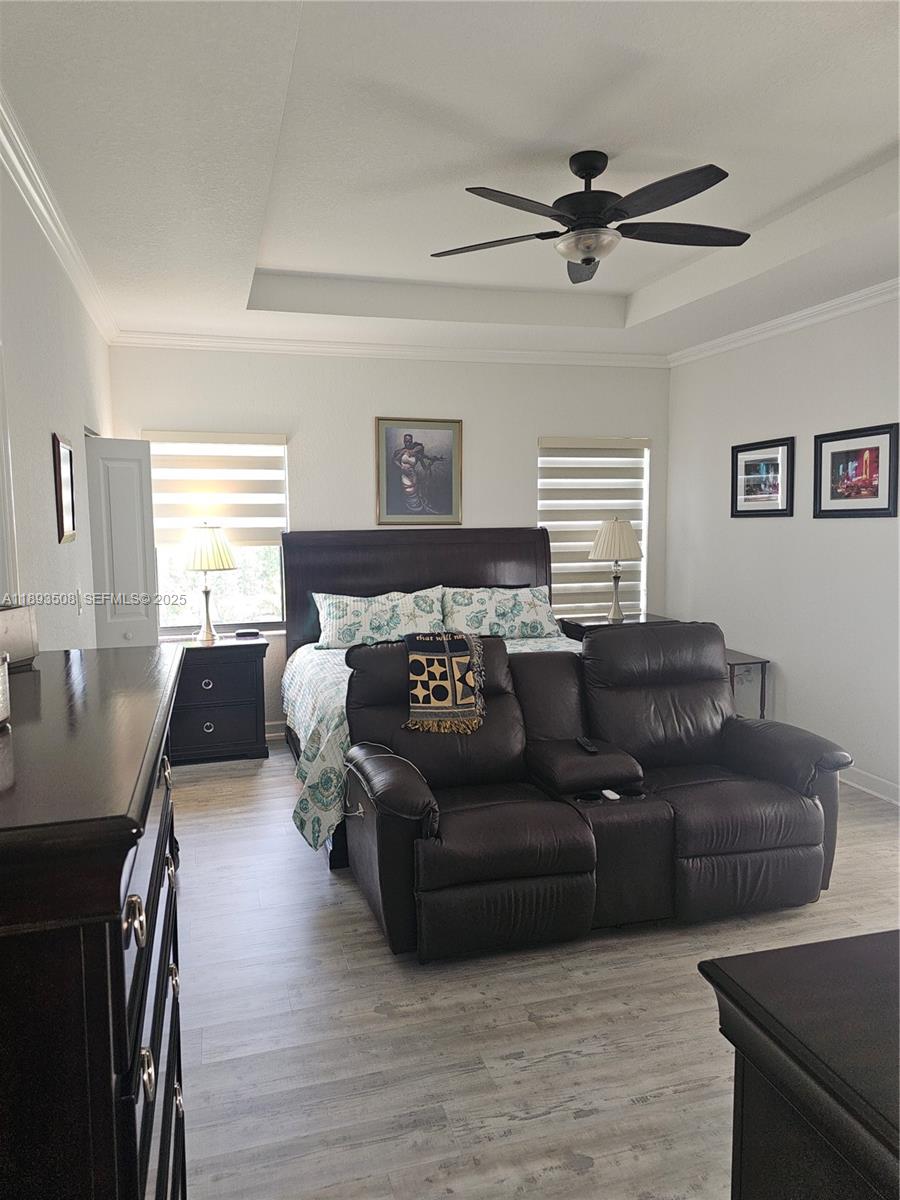 18964 Southwest 135th Avenue Miami, FL 33177 - Photo 20 of 39 a living room with furniture and a wooden floor