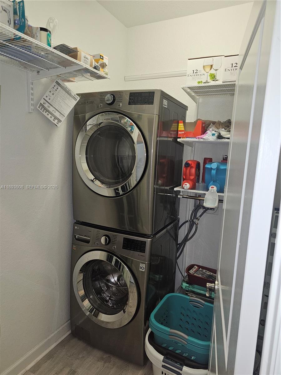 18964 Southwest 135th Avenue Miami, FL 33177 - Photo 24 of 39 a utility room with dryer and washer