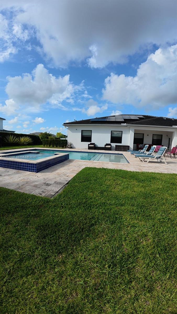 18964 Southwest 135th Avenue Miami, FL 33177 - Photo 33 of 39 a house view with swimming pool and garden space