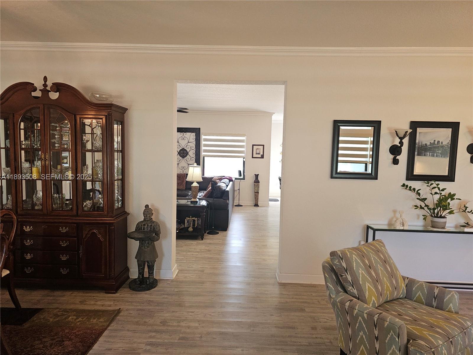 18964 Southwest 135th Avenue Miami, FL 33177 - Photo 5 of 39 a living room with furniture and wooden floor