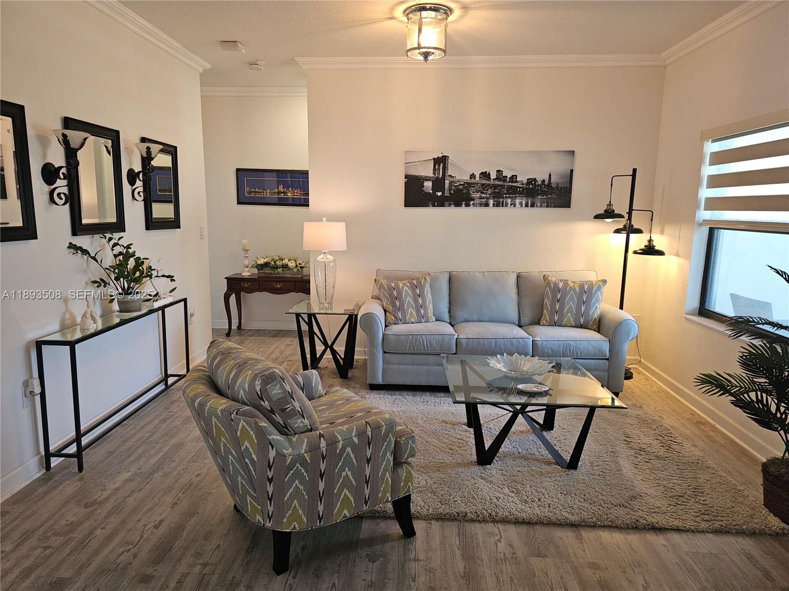 18964 Southwest 135th Avenue Miami, FL 33177 - Photo 7 of 39 a living room with furniture and wooden floor