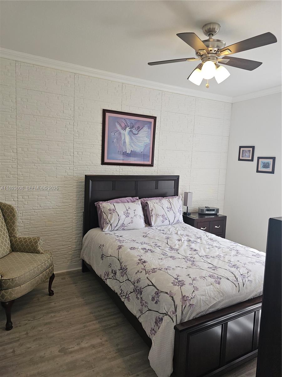 18964 Southwest 135th Avenue Miami, FL 33177 - Photo 10 of 39 a bedroom with bed and a couch