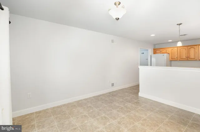 an empty room with sliding glass door