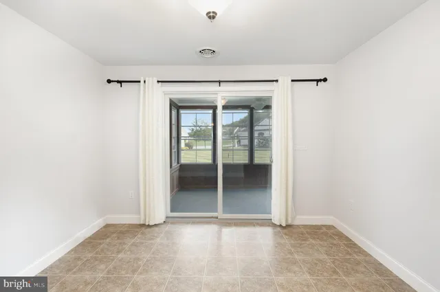 a view of an empty room with a large window